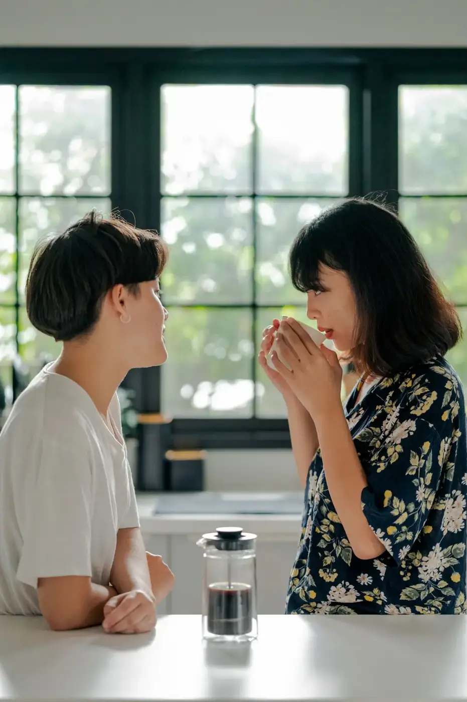Couple sharing coffee in their kitchen